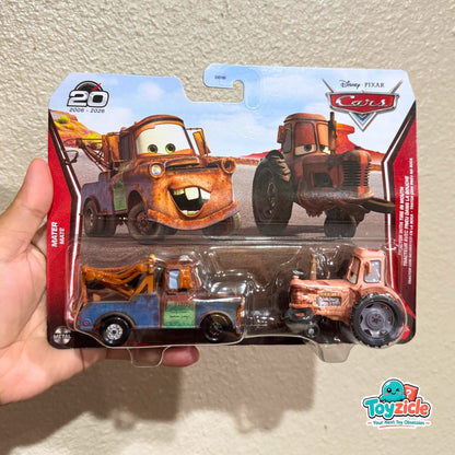 Disney Pixar Cars - 20th Anniversary Mater & Tractor with Tire in Mouth Diecast Car 2026 - 2 Pack